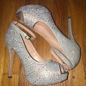 Silver pumps with white crystals.